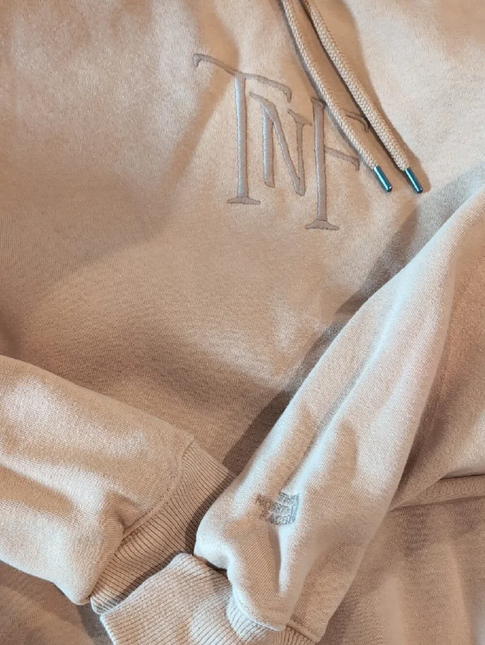 The North Face tan/beige pullover hoodie with logo tag